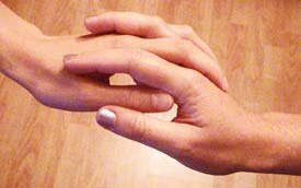 two women holding hands