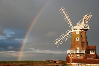 rainbow over windmill