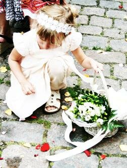 child picking up confetti