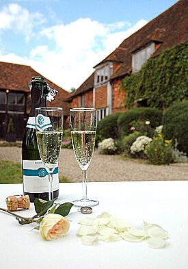 front of house and two champagne glasses