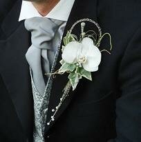 groom with buttonhole of flowers