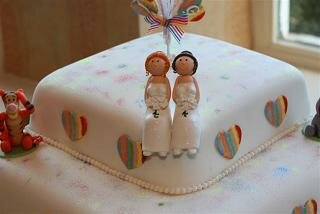 cake with two female toppers