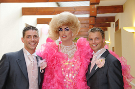 Miss Dot Com and two grooms